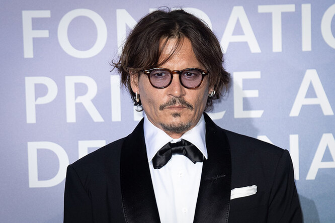 Earring stars: Ford, Depp and other famous men with pierced ears Earring stars: Ford, Depp and other famous men with pierced ears