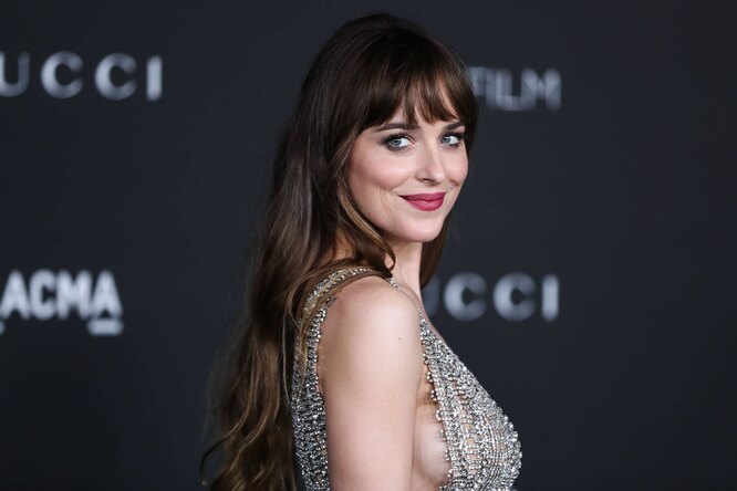Dakota Johnson shows how to wear a white blazer with minis and mules